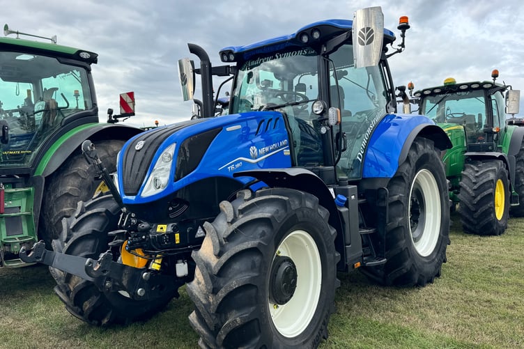A shiny New Holland tractor in the line up before the Memorial Tractor Run. AQ 1938