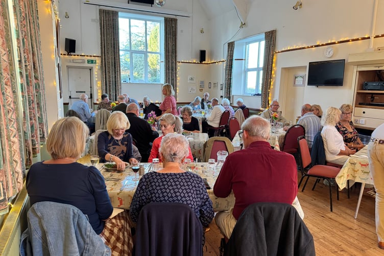 Many people attended the harvest supper in Coldridge Village Hall. AQ 1595