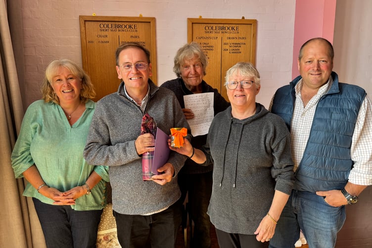 Postie Dave Wright, second left, with left, Tracey Bragg, and from third left, John Richards, Wendy Oliver and Steve Smith at Colebrooke for his retirement surprise party. AQ 2105