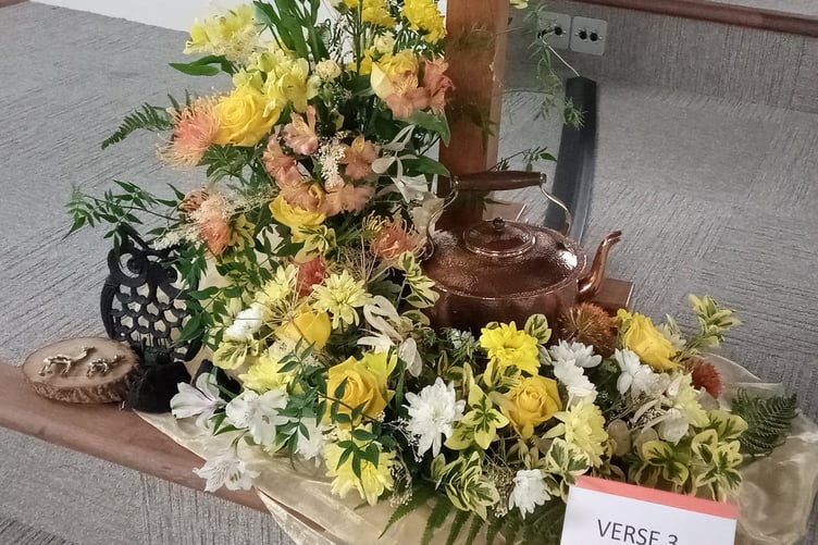 The floral arrangement with the theme Praise God for the harvest that’s quarried and mined.