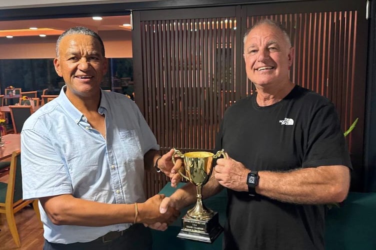 Club Captain Gerald Abdoll presenting Andy Dafters with the Order of Merit Trophy.