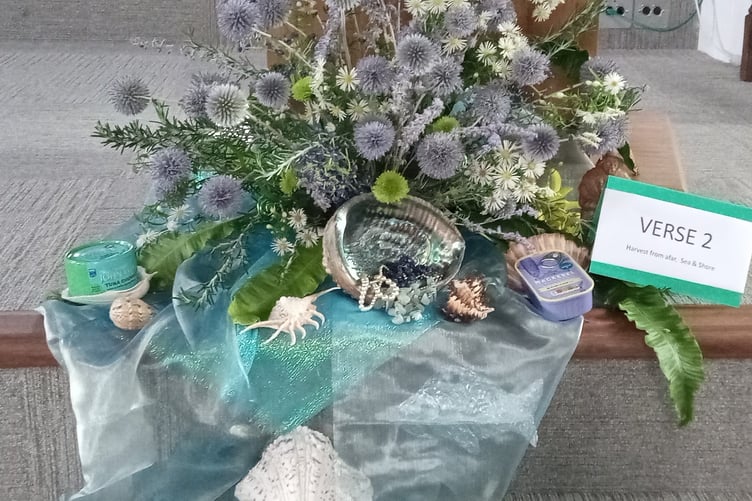 The floral arrangement with the theme Praise God for the harvest of the sea and the shore.