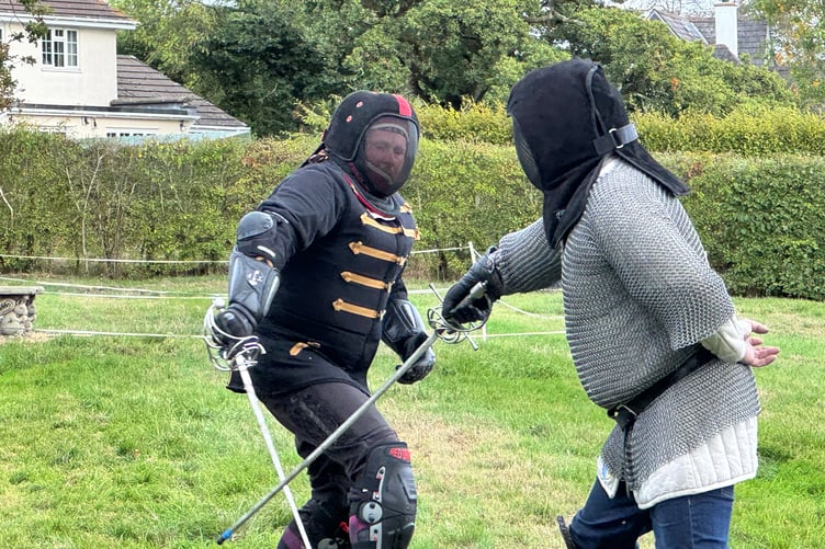 Demonstrating sword fighting at Spreyton Church anniversary weekend. AQ 1862
