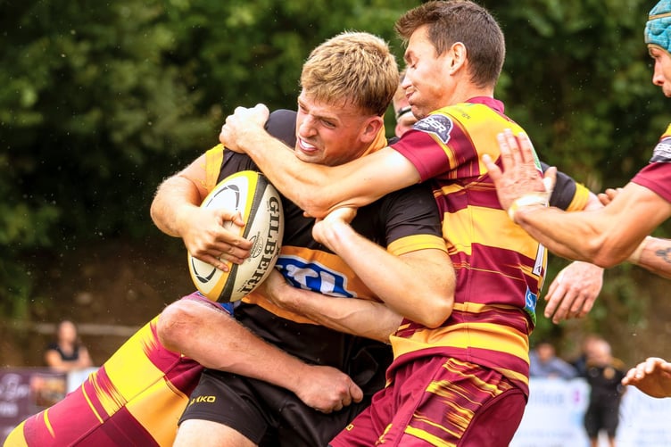 Ollie Jeffery smashing into the Okehampton defence