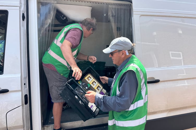 Exeter Food Action volunteers unloading food items. AQ 1999