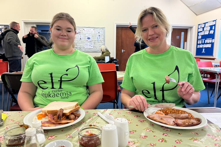 Volunteers ready to tuck in when it quietened down. AQ 3166