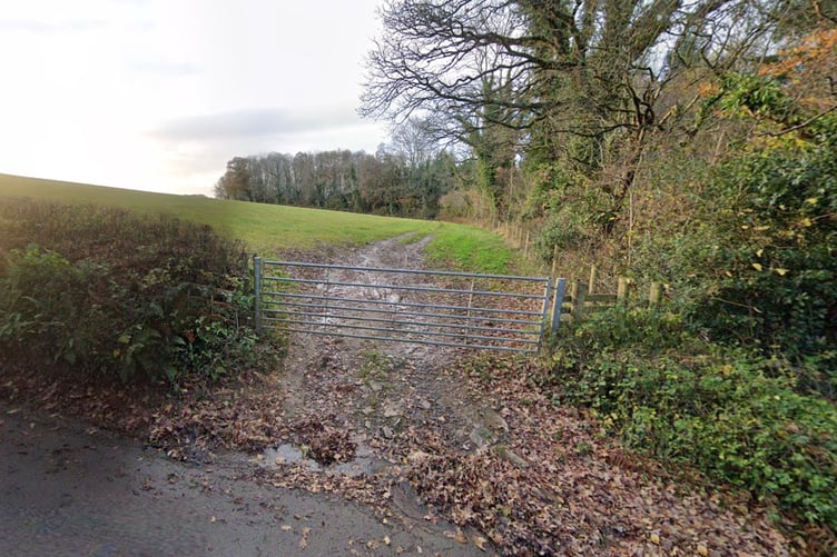 Gate to the field where the houses would be located