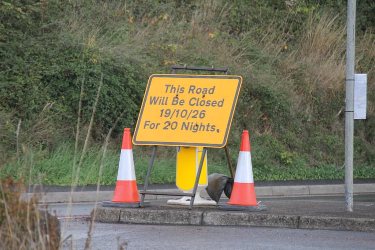 A road sign warning of the closure