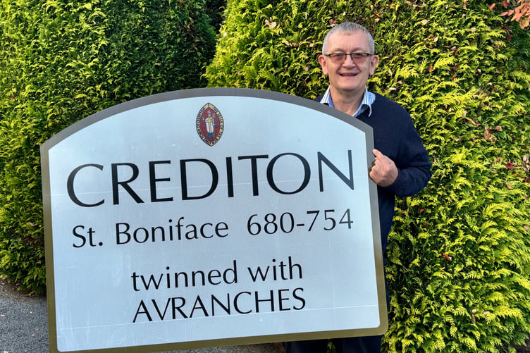 Courier Editor Alan Quick with the Crediton sign he retrieved from Bow. AQ 3854