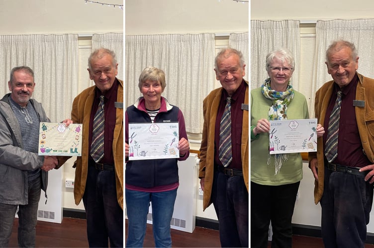 24 October 2026 From left, Martin Taylor receiving the 'thriving' IYN award for the primary school, Halcyon Pughe receiving the 'outstanding' IYN award for the arboretum, and Sue Rowell receiving the 'thriving' award for the village green from Paul C