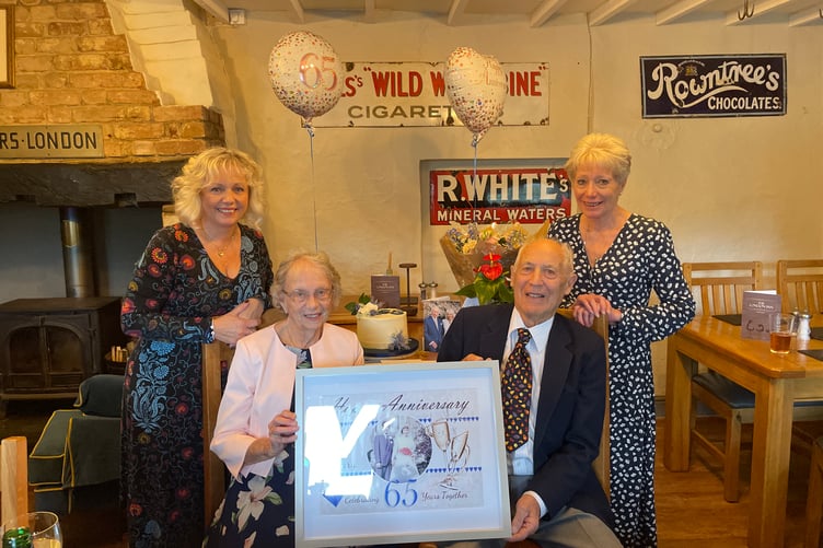 Mary and Maurice Glover celebrating their 65th wedding anniversary with daughters Denise, left, and Dawn, right